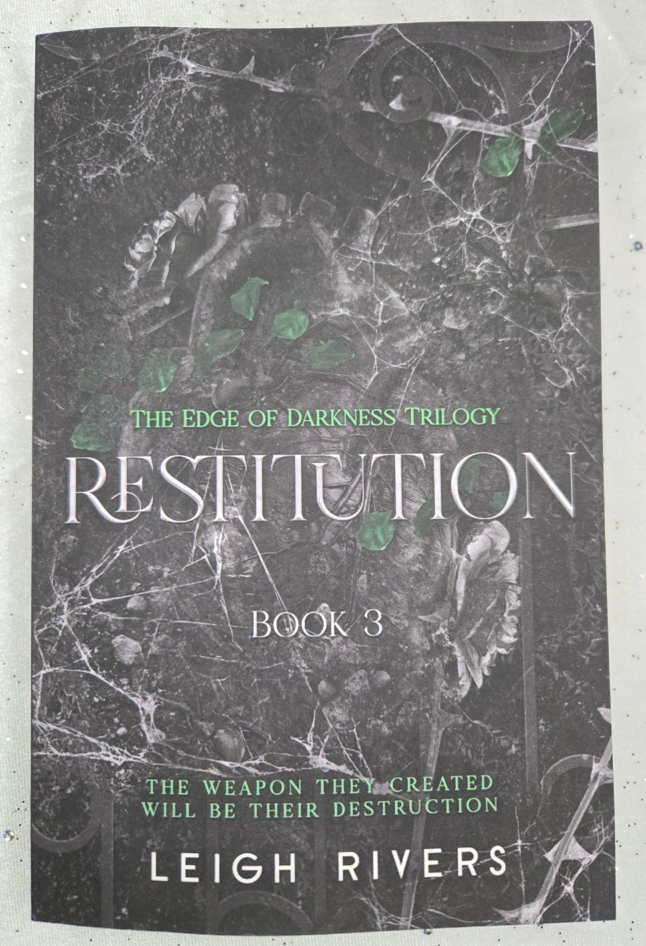 Restitution, Leigh RIvers (softback)